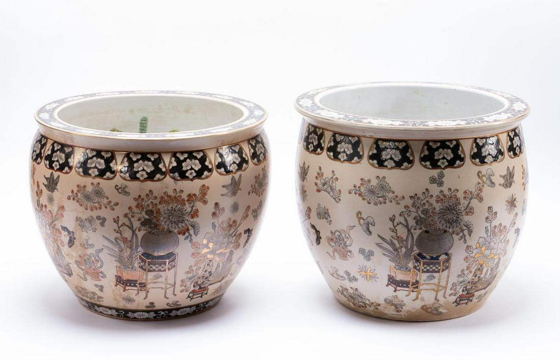 PAIR, CHINESE FLORAL PATTERNED FISHBOWL PLANTERS: Chinese. Near pair of floral patterned porcelain fishbowls having a cream ground, the bodies decorated florals in vases on stands and the interior with goldfish. Marked to the bottom. Approx. of one, 