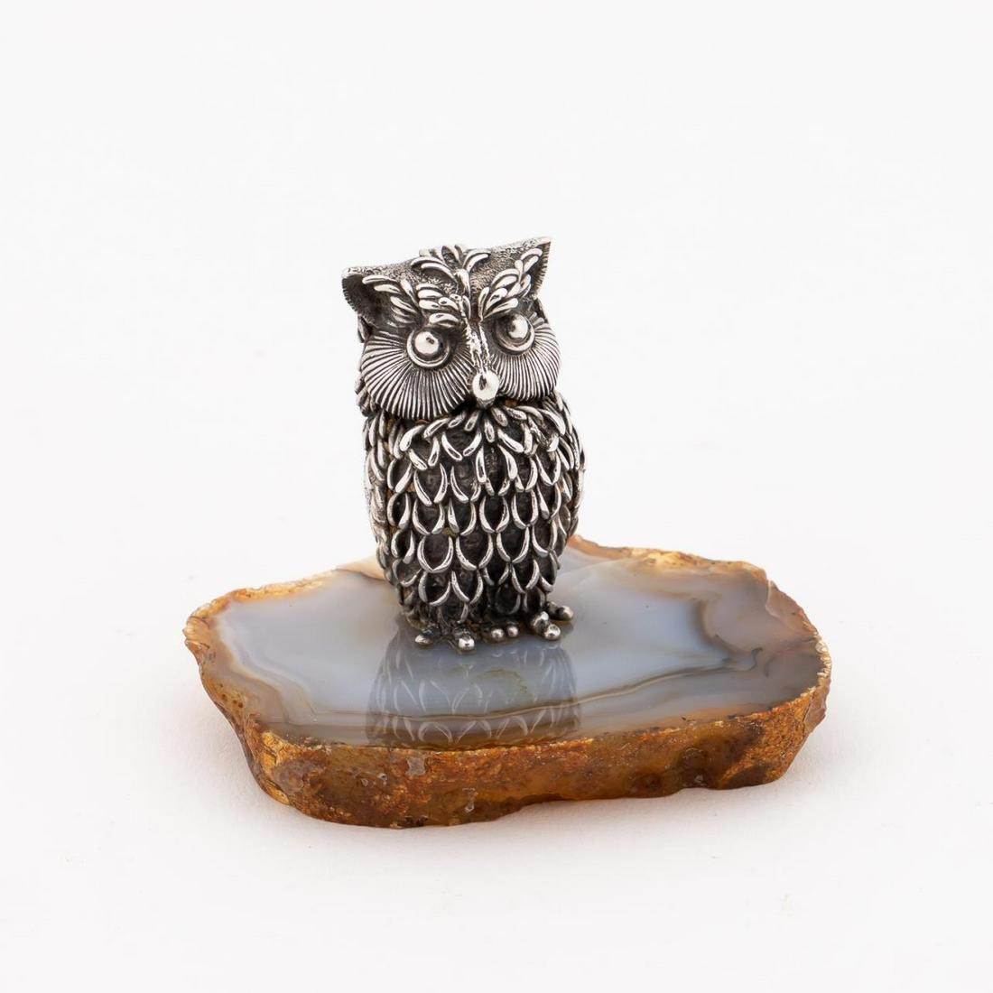 CARTIER SMALL .800 SILVER SCULPTURE OWL ON AGATE: Style of Aurelio Teno (Spanish,1927-2013) for Cartier (French). Small whimsical owl sculpture in.800 silver on agate slice base. Small makers' plaque and silver fineness, and Italy to back. Approx. h.