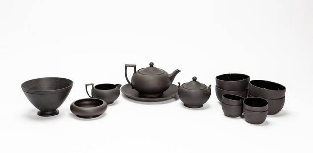 WEDGWOOD BASALT TABLEWARE INCL. KEITH MURRAY, 14PC: Wedgwood (British), 20th century. Fourteen-piece black basalt stoneware tableware grouping comprising: a Keith Murray (New Zealander, 1892 – 1981) conical form bowl (dated 1955, shape shape 3813), a