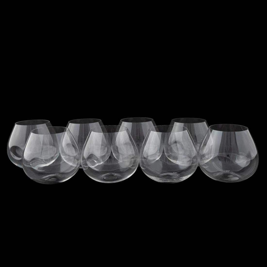 SET OF 8 ELSA PERETTI FOR TIFFANY WINE GLASSES: Elsa Peretti for Tiffany & Co. (American), contemporary. Set of eight colorless crystal and stemless wine glasses with side thumb print. Appropriately marked to underside. Approx. h. 4".