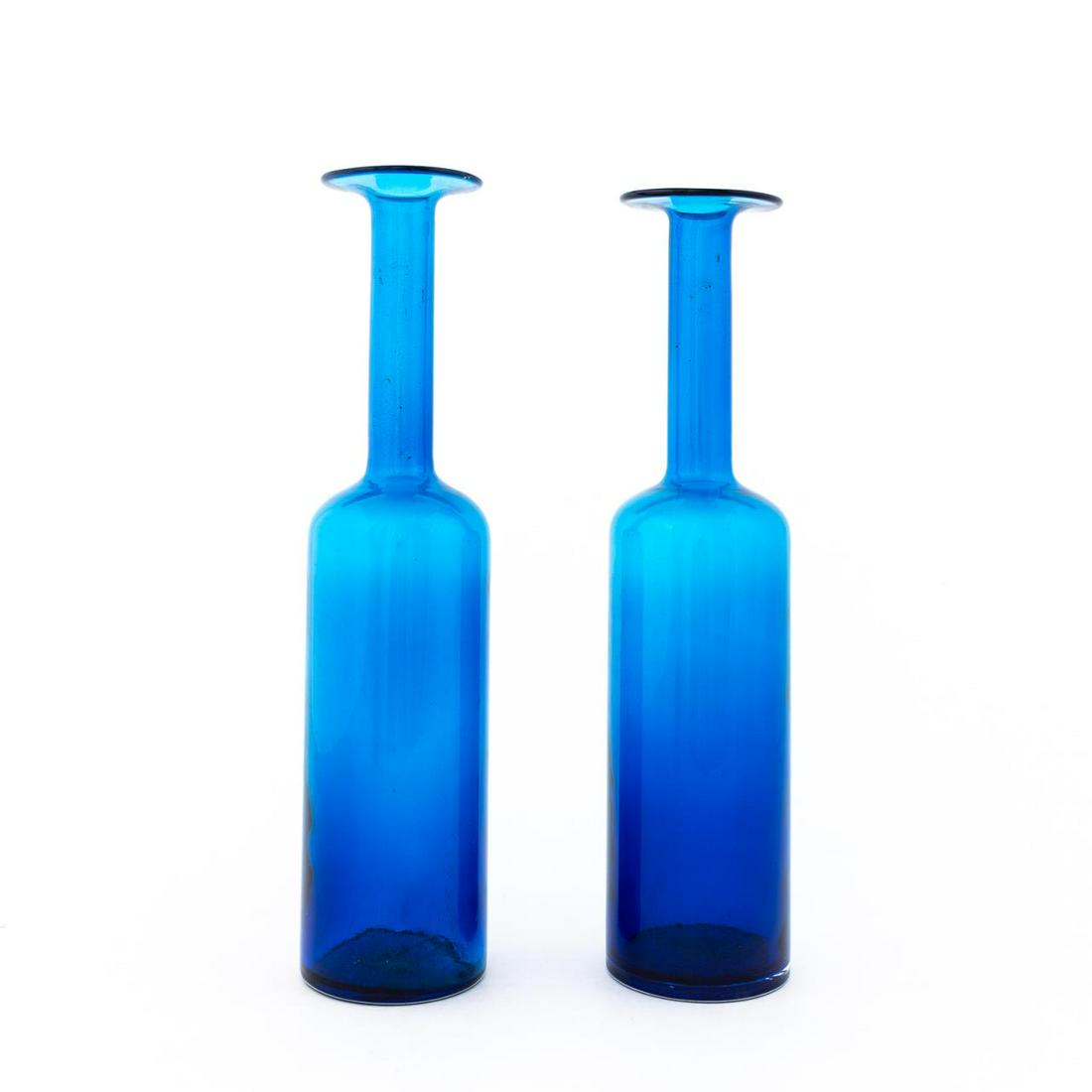 PAIR, TALL BLUE ART GLASS BOTTLES, BLENKO STYLE: American, 20th century. Pair of Blenko-style blue art blown glass bottles. Apparently unsigned. Approx. h. 16.75"