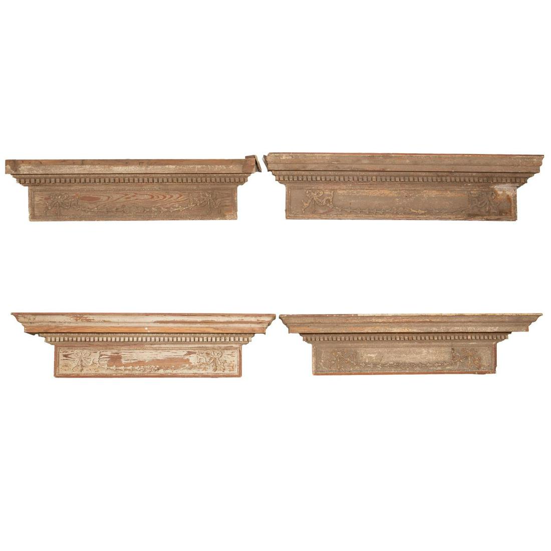 SET 4, NEIL REED CLASSICAL REVIVAL OVERDOORS: American, 1920s. Set of four carved wooden architectural classical federal revival overdoors of various sizes, each having a shaped cornice, egg and dart and dentil moulding, and panel with ribbon tie