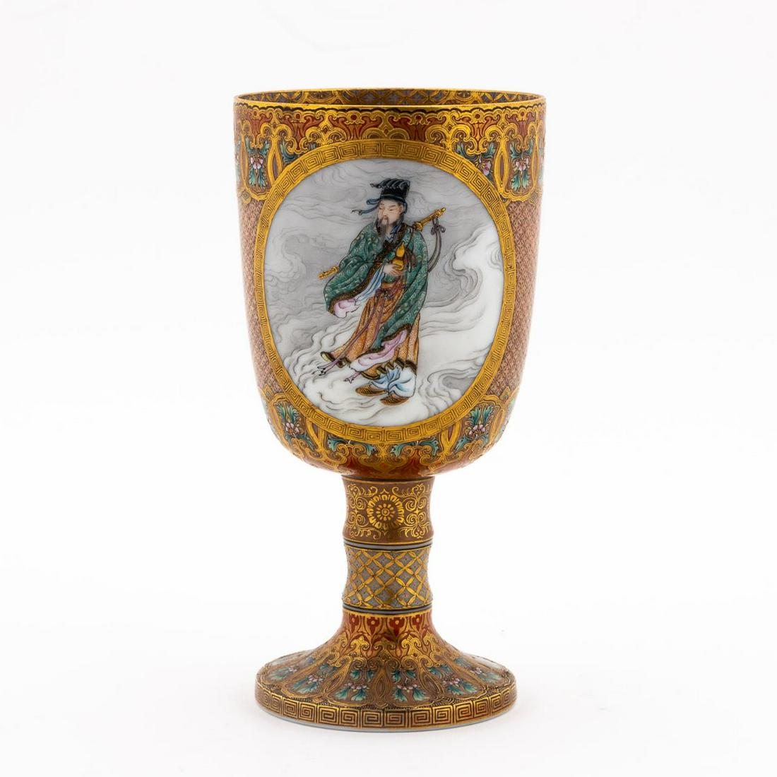 JAPANESE KYOTO SATSUMA ENAMELED & GILT GOBLET: Japanese. Kyoto Satsuma porcelain goblet, heavily decorated with gilt and iron red enamels, incorporating geometric and floral motif surrounding meander pattern medallions with male immortal on one si
