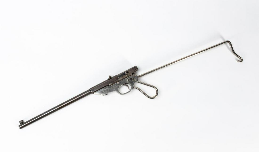 QUACKENBUSH BICYCLE SINGLE SHOT RIFLE. Cal. 22: Quackenbush (American), circa 1886. Single shot bicycle rifle, 22 cal octagon shank, fixed sights, blued breech and nickel finish frame and wire pistol grip. Approx. 14.5", extended 26.375".