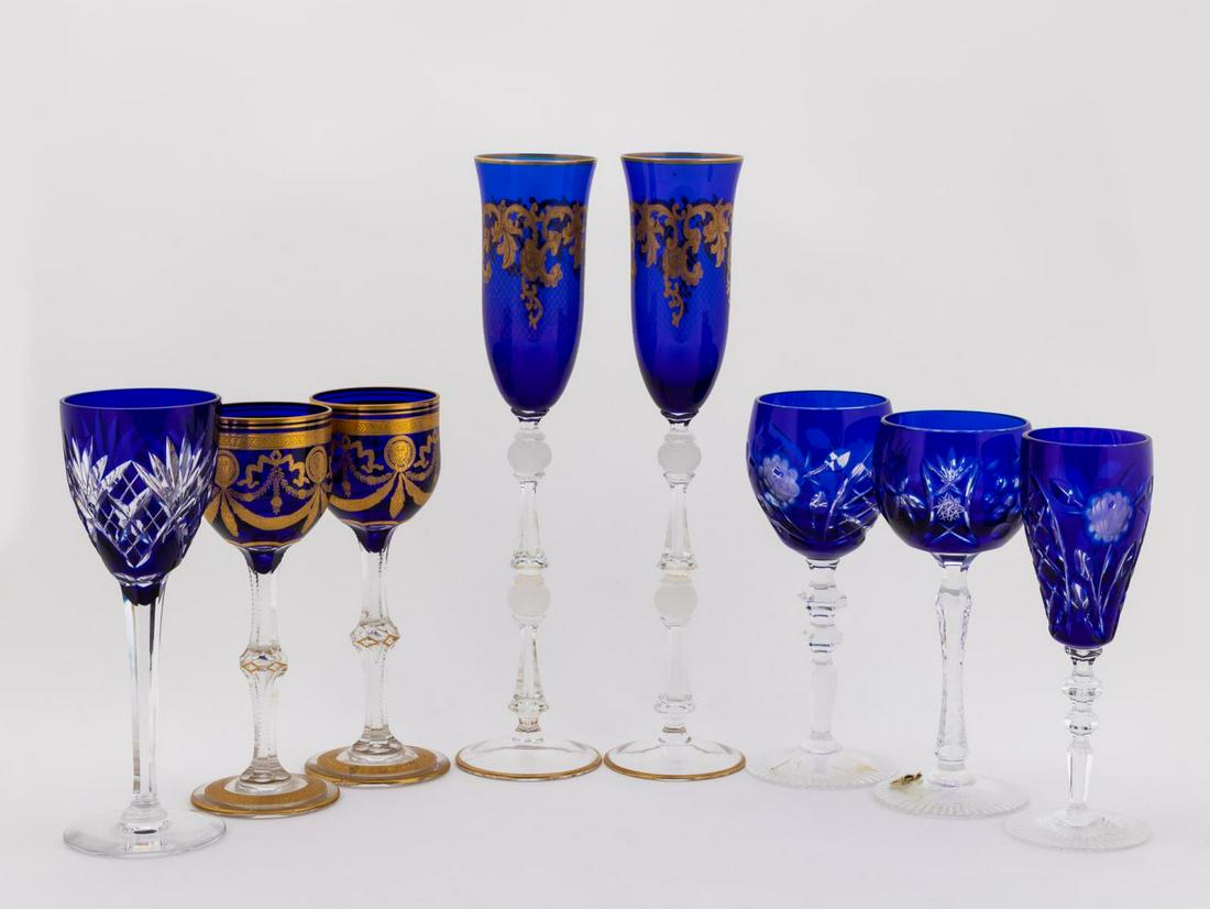 ASSORTED COBALT STEMWARE INCL. ST. LOUIS, 8PCS: Continental, 20th century. Eight-piece assortment of cobalt blue glass stemware comprising: Saint Louis, pair of "Congress" gold encrusted burgundy wine glasses (7.75") and cased cut-to clear wine gla
