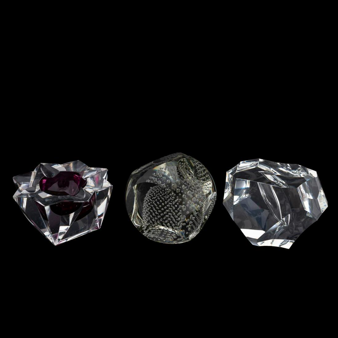 3 CRYSTAL TABLE ACCESSORIES, STEUBEN & ST. LOUIS: Group of three crystal table accessories comprising of a Steuben "Excalibur" paperweight without sword, one St. Louis (French) ashtray, and one Murano style paper weight with bollinato decoration. Two