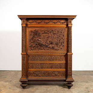 LUIGI FRULLINI MYTHICAL CARVED WALNUT SECRETARY: Luigi Frullini (Italian, 1839-1897), second half 19th century. Exuberantly carved Italian Renaissance revival walnut secretary desk, having a shaped overhanging rais-de-coeur cornice, frieze with garl