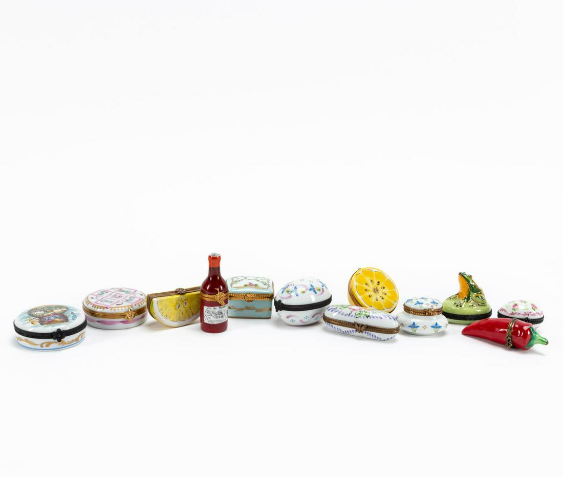 GROUP, TWELVE LIMOGES PORCELAIN DECORATIVE BOXES: Various makers, (French), contemporary. Group of twelve hand-painted Limoges hinged porcelain decorative boxes of various forms including traditional shapes with floral decoration, a chili pepper, fro