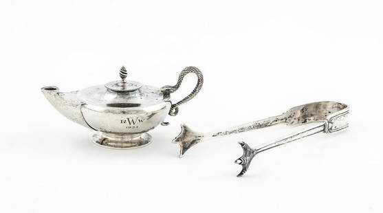 TIFFANY & CO. SILVER SMOKERS COMPANION & TONGS: Two sterling silver table articles comprising: a Tiffany & Company Aladdin lamp-form smokers companion lighter (marks of Richard Comyns, London, 1930; stamped "1033") with "RWW/1933", monogram for