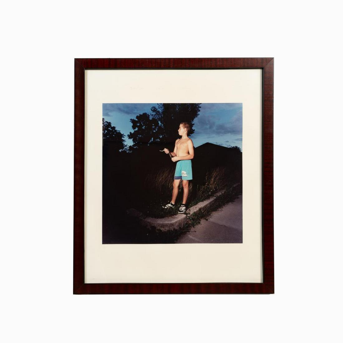 CHRIS VERENE, COLOR PHOTO "JOSH AND HIS SNAKE": Chris Verene (American b. 1969), color photograph "Josh and His Snake" depicting a shirtless boy holding a small snake, inscribed above image, apparently unsigned. Provenance: From the Private Collect