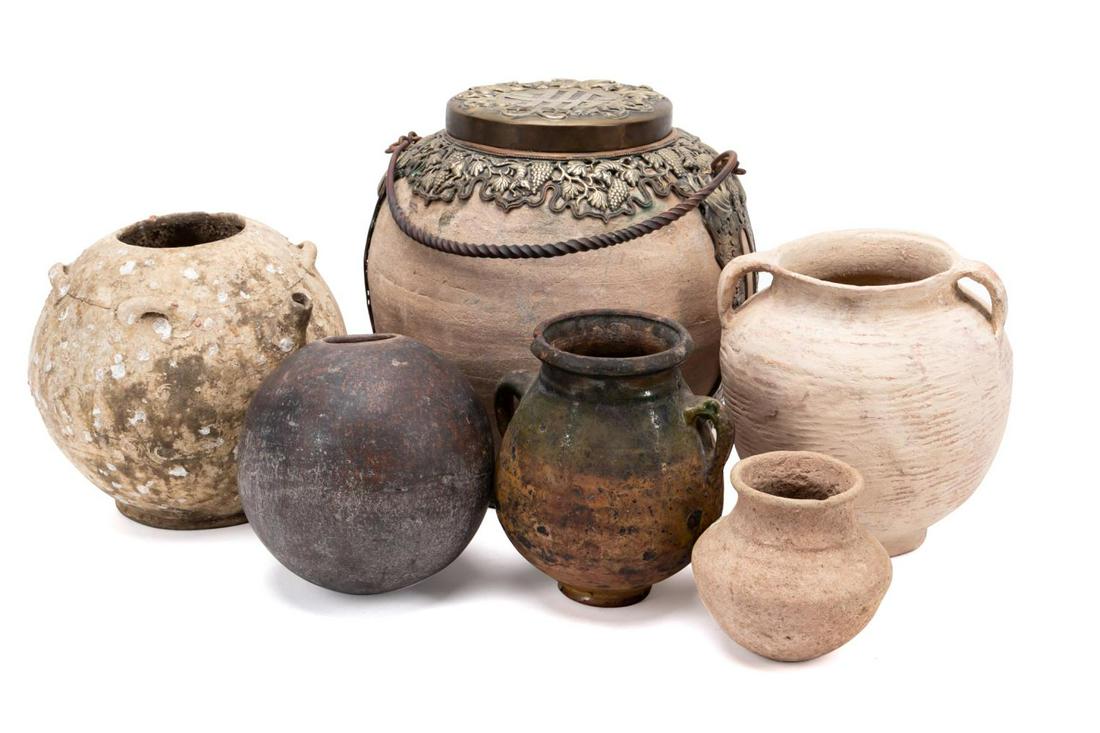GROUP 6 ASIAN & MODERN POTTERY VESSELS: Collection of terracotta pottery, comprising one Vietnamese jar with figural brass mounts and lid having shou, bat, grape, and rat motif, one wine ewer from shipwreck possibly Vietnamese, one small ol