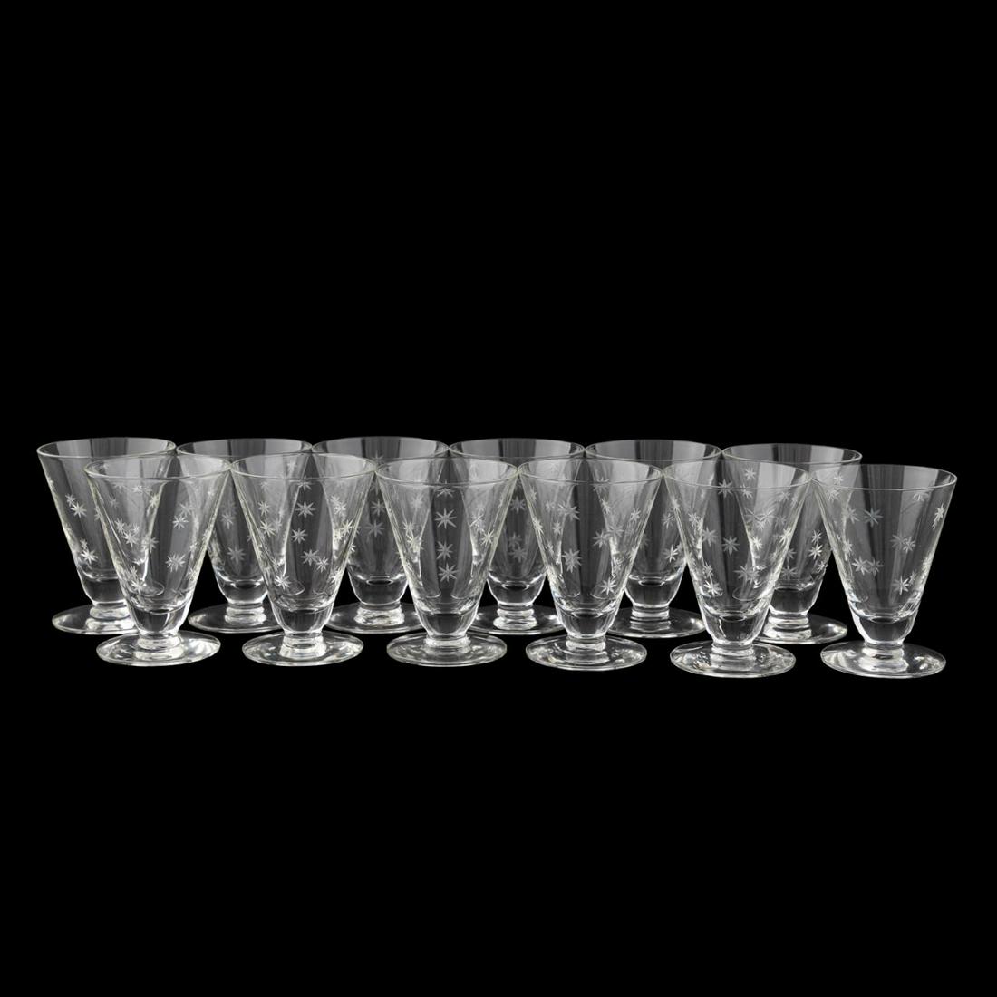 SET 12 VINTAGE ATOMIC STAR MOTIF COCKTAIL GLASSES: American, mid-twentieth century. Atomic star colorless shrub or cocktail glasses. Unmarked. Approx. h. 3.5".
