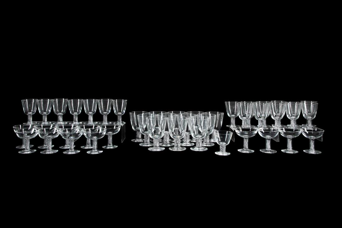 SET OF STEUBEN AIR TWIST GLASS STEMWARE, 44PC: Steuben, forty-four piece set of colorless glass air twist (7917 or 8011) stemware comprising: twelve goblets (h. 5.75"), eleven wine glasses (h. 5.25"), seven wine glasses (h. 4.75" to 5"), nine coup