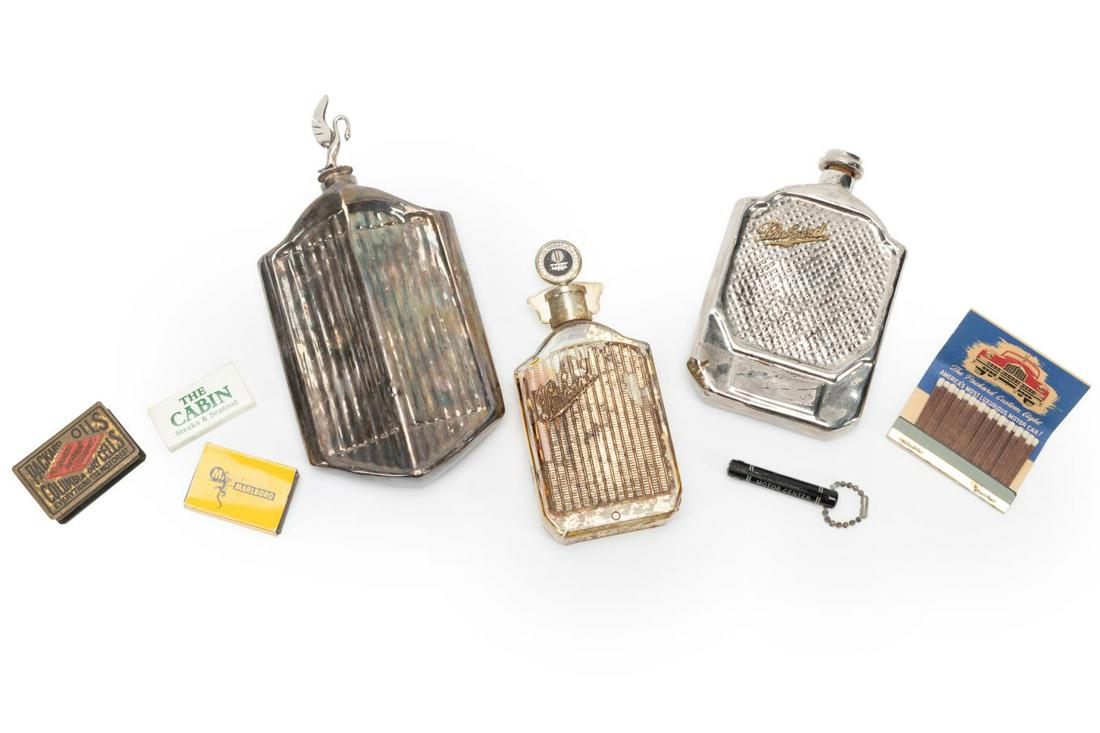 ASSTD. PACKARD COLLECTIBLES INCLUDING FLASKS, 6PC: Six piece assortment of Packard Motor Car Company (American 1899-1958) collectibles comprising: a silverplate radiator form flask from the Joy Brothers Packard Motor Company dated 1934, a chrome plate