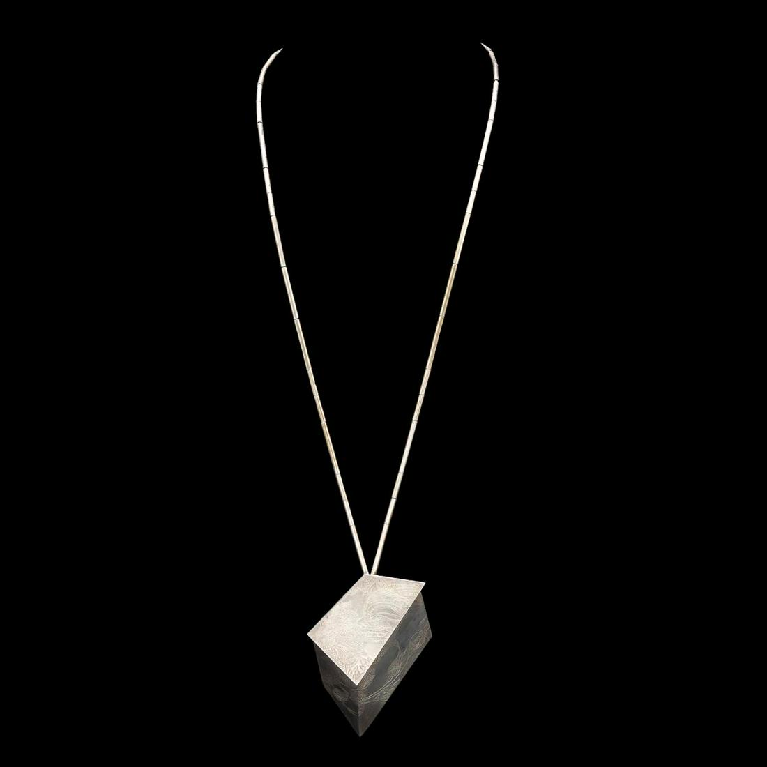THREADGILL STERLING & 22K STUDIO LOCKET & NECKLACE: Linda Threadgill (American b. 1947), hand made Studio locket and necklace, executed in embossed sterling, polychrome, and 22k yellow gold, the asymmetrical box form locket opening to an abstract 22k g