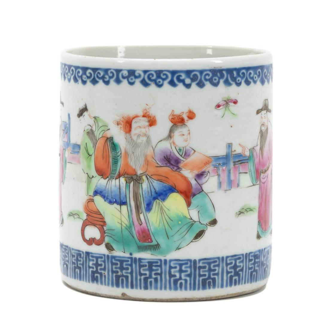 DIMINUTIVE CHINESE FAMILLE ROSE BRUSH POT: Diminutive Chinese Famille Rose brush pot, of cylinder form, having a ruyi band above a scene of the Emperor, Empress, and their two sons, being attended by courtiers in a courtyard, terminating to a 