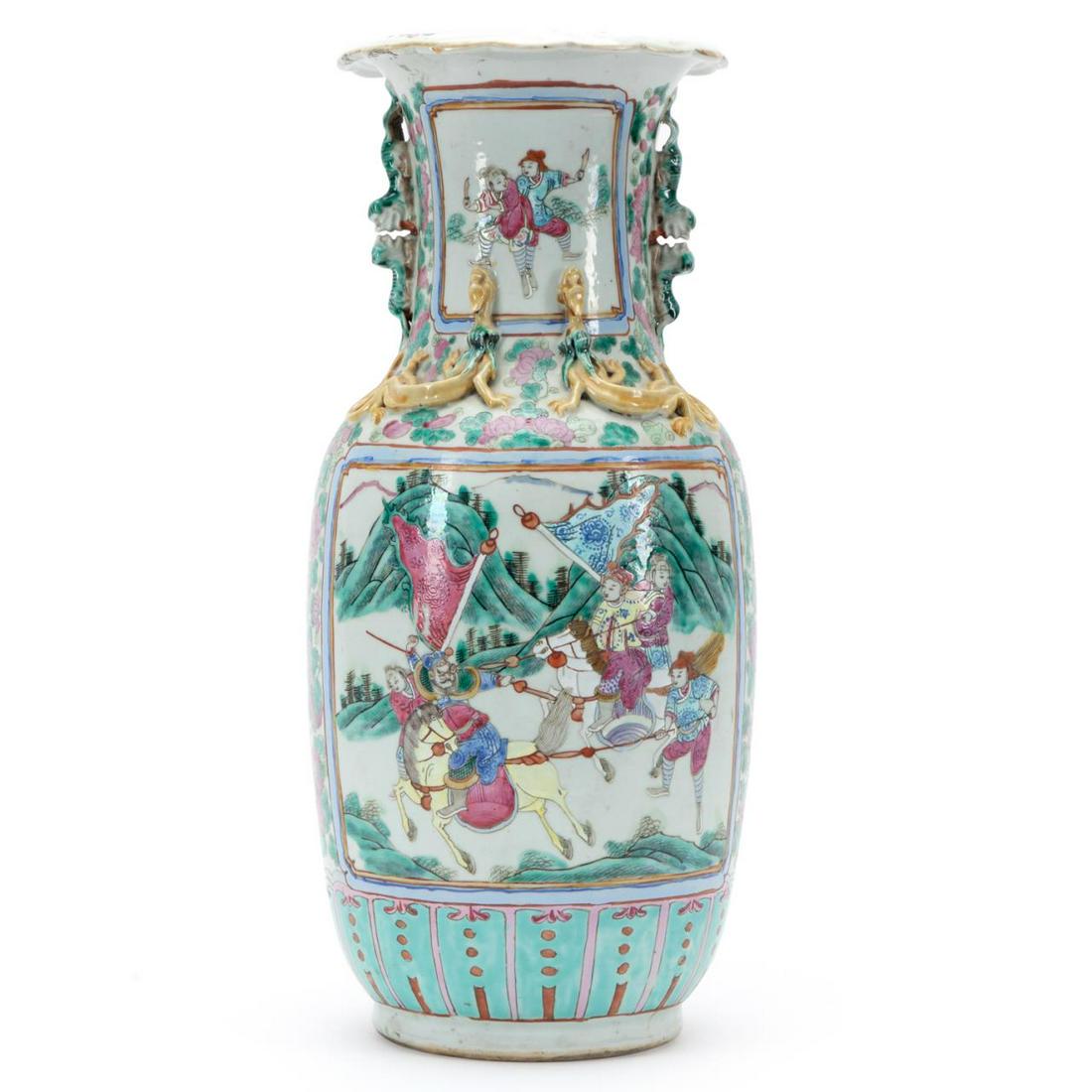 CHINESE FAMILLE ROSE BALUSTER VASE: Chinese Famille Rose baluster vase, having a scalloped rim above a trumpet neck flanked by Buddhist lion handles and applied chichi dragons, above a body with reserves depicting court scenes on a pink