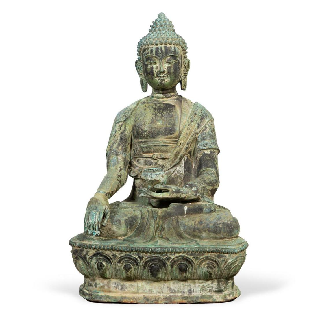 MONUMENTAL PATINATED METAL SHAKYAMUNI BUDDHA: Monumental patinated metal seated Shakyamuni Buddha, depicted holding a vessel in one hand and performing the Bhumisparsha or earth touching mudra with the other, resting on a lotus base with verdigri