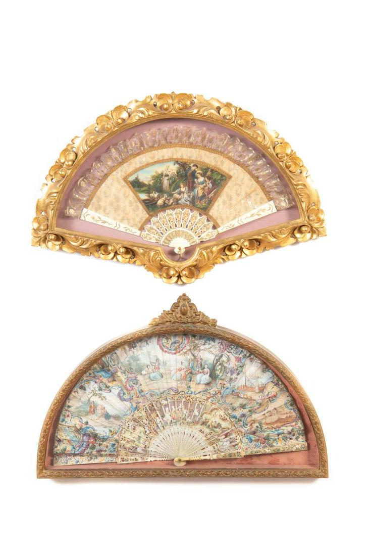 GROUP OF TWO PAINTED FANS IN SHADOWBOX FRAMES: Likely Continental, first quarter 20th century or earlier (one frame later), group of two hand painted fans in shadow box frames comprising: a fan with celluloid or bone sticks and having a figural la