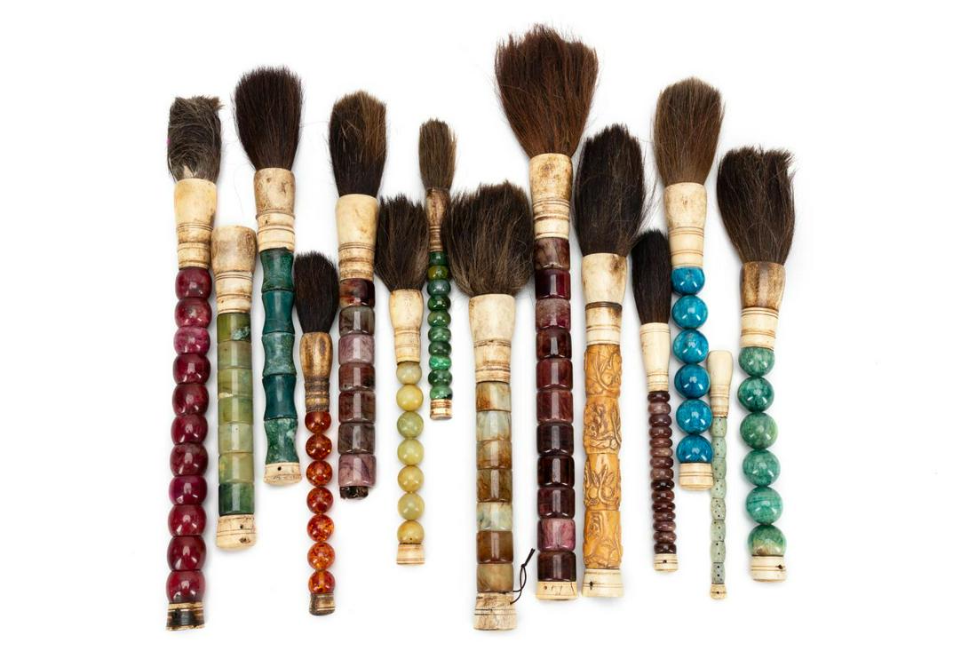 (14 PCS) CHINESE INK BRUSHES W/ HAIR TIPS: Fourteen Chinese ink brushes with animal hair tips, used for calligraphy painting, each having a bone or resin cap surmounting the hard stone, dyed stone, bone, or resin shaft, and terminating to long