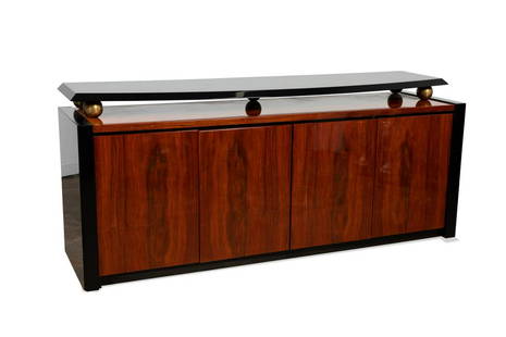 PIETRO COSTANTINI FOR ELLO LACQUERED CREDENZA: Pietro Costantini (Italian) for Ello Furniture (American), late 20th century, Postmodern wood and lacquer buffet, having a recessed black top resting on gilt circular supports, over four hinged doors,