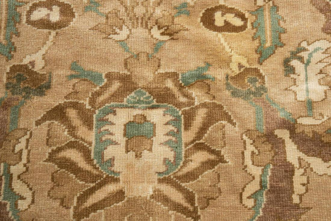 HAND KNOTTED WOOL FLORAL DESIGN RUG 14 x 10: Hand knotted wool floral design rug, executed in wool on wool, likely Turkish, having an allover design of florals and tendrils in celadon, tan, and chocolate on a beige field, with a Herati border on