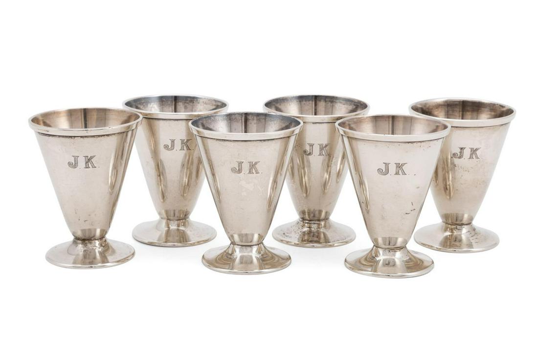 SET OF SIX ARISTON STERLING SILVER SHERRY GLASSES: Set of six Ariston Silversmith Corp. (New York 1927) sterling silver sherry glasses, circa 1930, of conical form, with folded rims, each rising on a circular foot, monogrammed 'JK', and marked 'Aristo