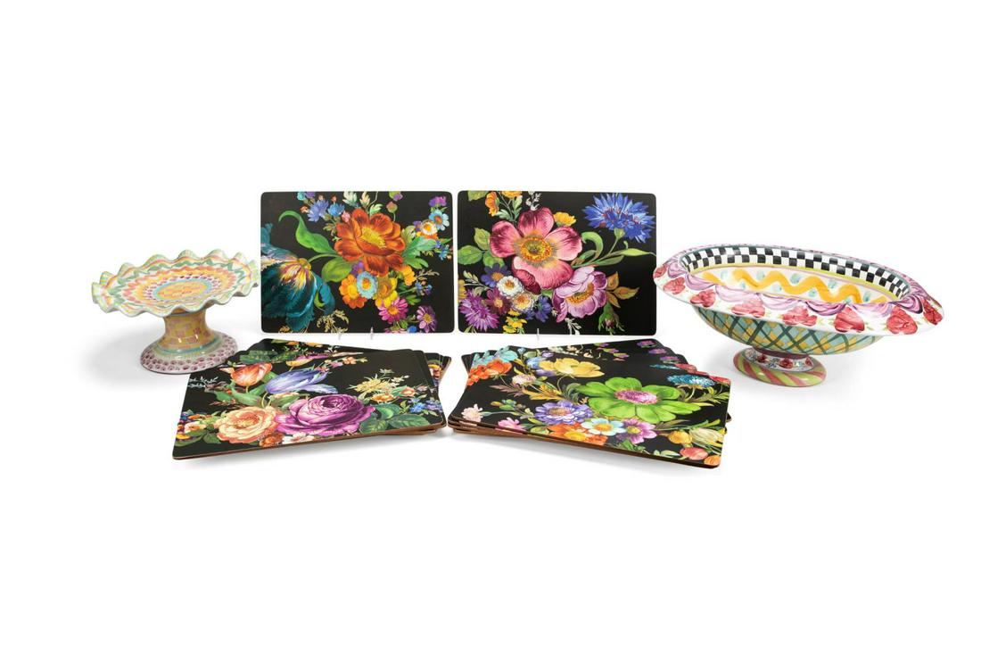17PCS MACKENZIE-CHILDS PLACEMATS AND TABLEWARE: Mackenzie-Childs (American 1983) seventeen piece selection of table accessories comprising, fifteen "Flower Market" cork backed placemats (h. 11.5", w. 15.75"), a Taylor collection "Ovation" oval pain