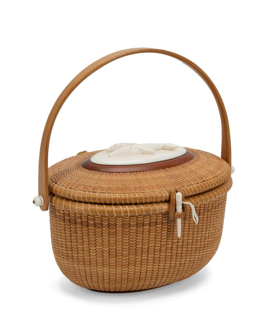 BOBBY & KAREN MARKS, NANTUCKET DOUBLE WHALE PURSE: Robert J. and Karen Marks (American 20th / 21st century), woven rattan and wood lidded basket purse, 1989, having an oval bone carved medallion with two humpback whales, inscribed under lid, artist si
