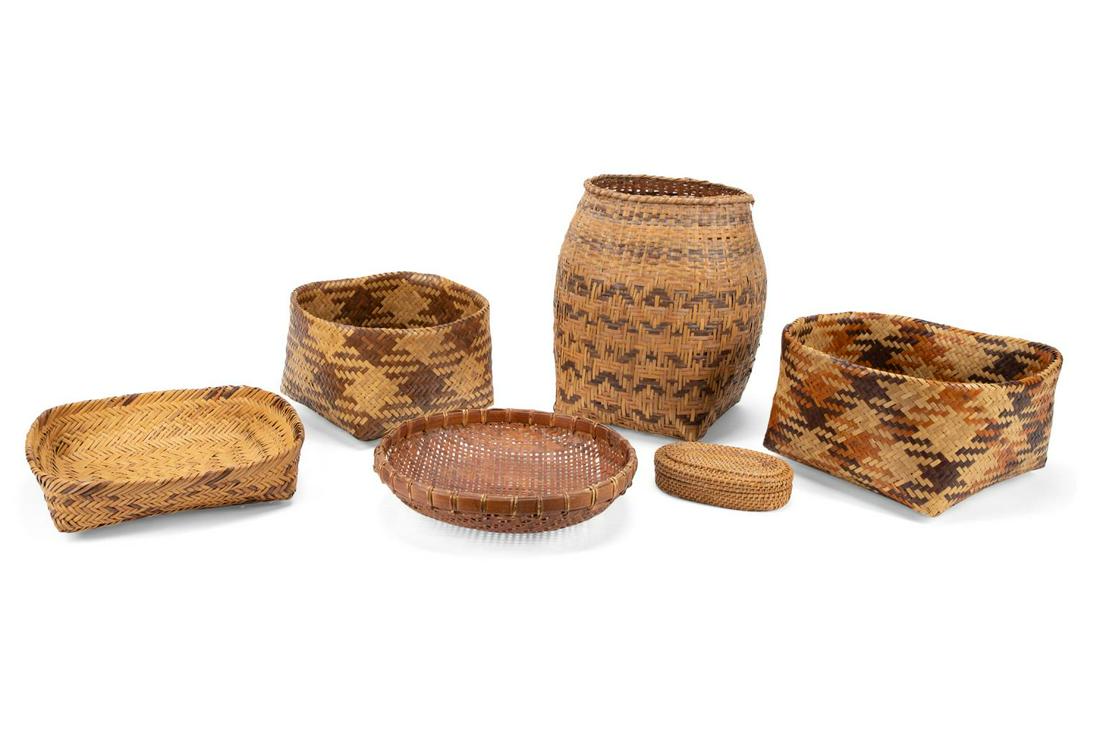 SIX WOVEN BASKETS INCLUDING CHEROKEE EXAMPLES: Six woven baskets, comprising four Cherokee river cane baskets: (1) tall gathering basket, (2) square double sided baskets in twill plait, and (1) fanner basket with a braided rim, these came with inf