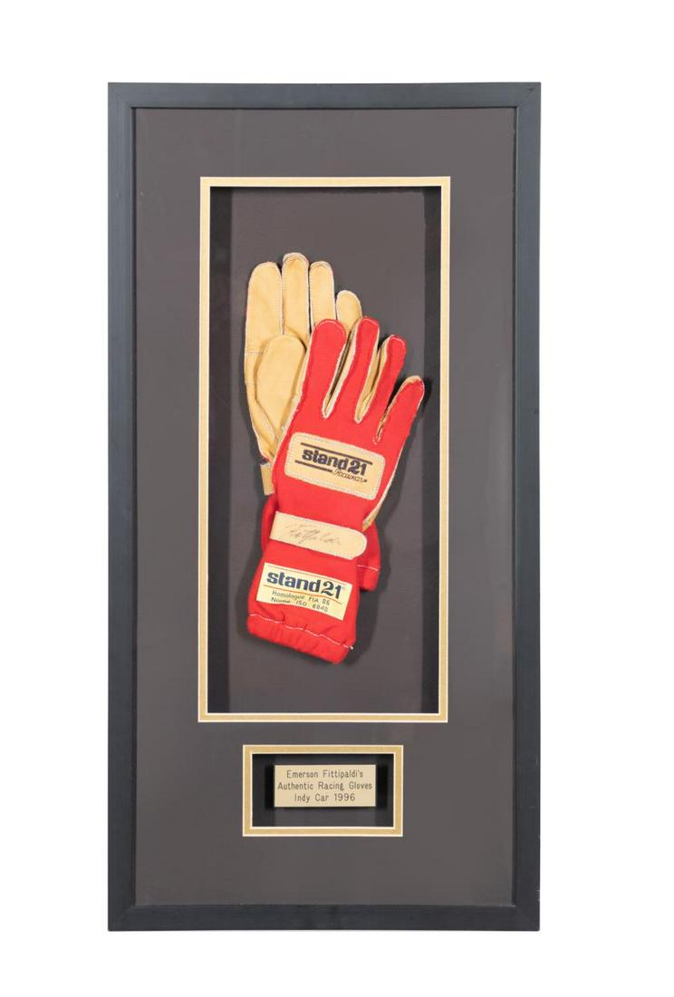 EMERSON FITTIPALDI INDY RACING GLOVES, 1996: Autographed 1996 Emerson Fittipaldi Indy Car racing gloves "Stand21 Racewear", autographed in ink, in a shadowbox. Provenance: From the Private Collection of Joel A. Katz, Atlanta, Georgia. Approx. fr