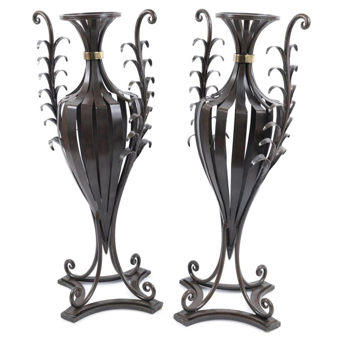 PAIR, WROUGHT IRON 'FERN' URNS: Pair of wrought iron 'Fern' urns in the Neoclassical taste, the pierced amphora style urns with foliate handles and integral stands, having no apparent marks. Provenance: From the Private Collection o