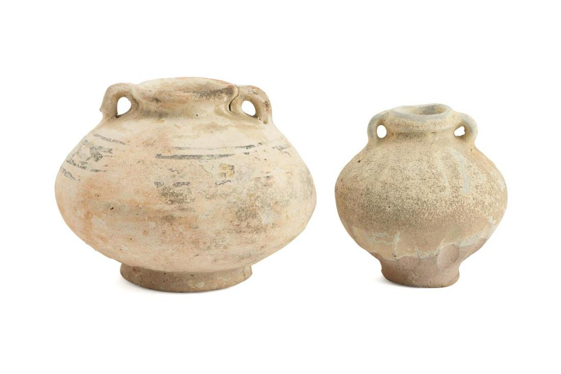 TWO THAI POTTERY JARS FROM THE TURIANG SHIPWRECK: Two Thai stoneware jars from the Turiang cargo ship wreck, mid 14th century, one in black underglaze and the other having vestiges of celadon glaze, pieces likely came from the Sisatchanalai kilns in