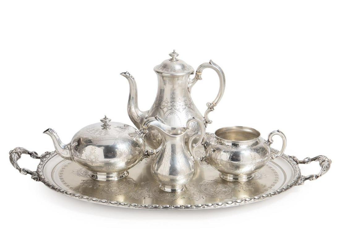 MACRAE STERLING TEA SERVICE W/ ASSOC. PLATE TRAY: Four piece English sterling tea service by Alexander Macrae, 1865, comprising a teapot, coffee pot, sugar bowl, and creamer, all of globular form rising on a flared circular base, having Gothic style 