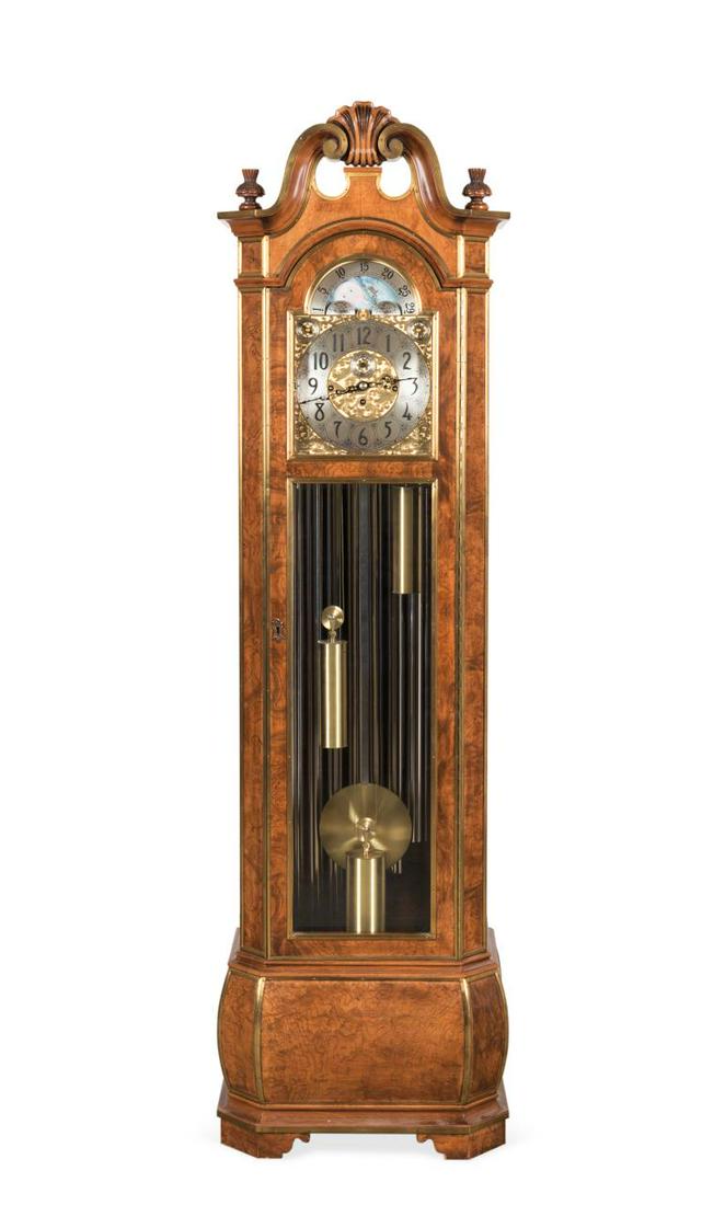 HERSCHEDE MODEL 250 BURL GRANDFATHER CLOCK: Herschede Clock Company (American 1902-1972), model 250 grandfather clock in the Baroque taste, having a brass inlaid Spanish burl olive ash veneer case, broken pediment with urns centering on a shell