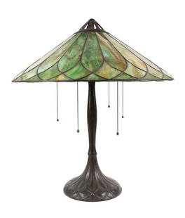 HANDEL LAMP WITH GREEN SLAG GLASS SHADE, C. 1908: Handel Lamp Company (American 1885-1941), table lamp and shade, circa 1908, the leaded green slag glass conical form shade on a five arm patinated bronze lamp base having three acorn form pulls, and s