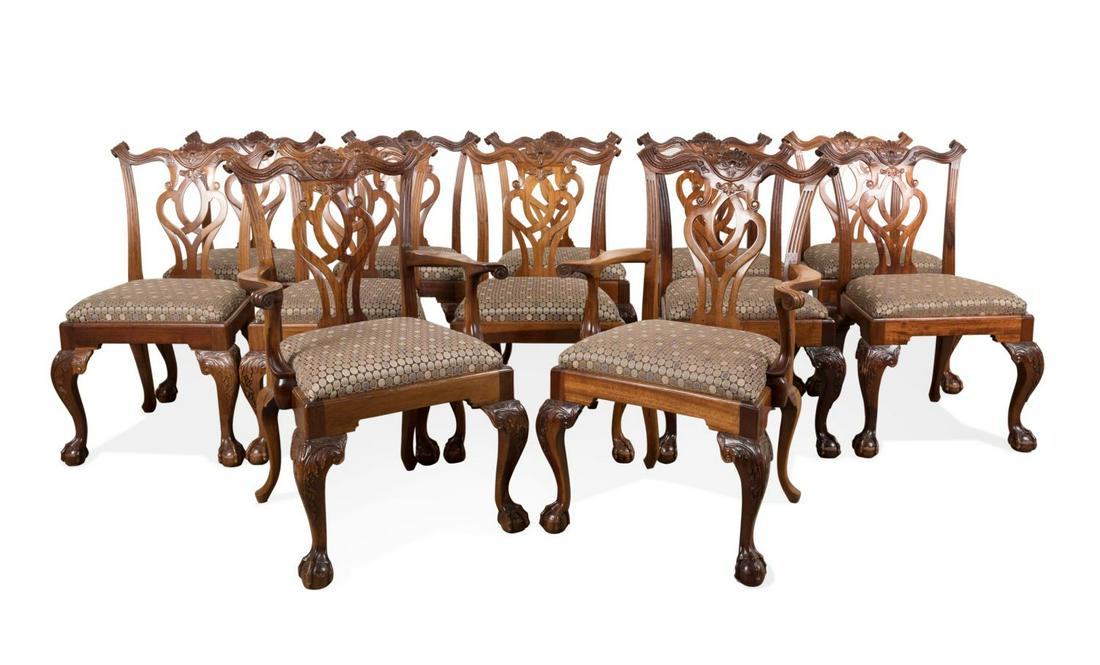 SET OF 12 GEORGE III STYLE MAHOGANY DINING CHAIRS: Set of twelve mahogany dining chairs in the George III Chippendale taste, comprising two arm and ten side chairs, each having a serpentine crest with scrolled ears centering on a scallop shell, pierce