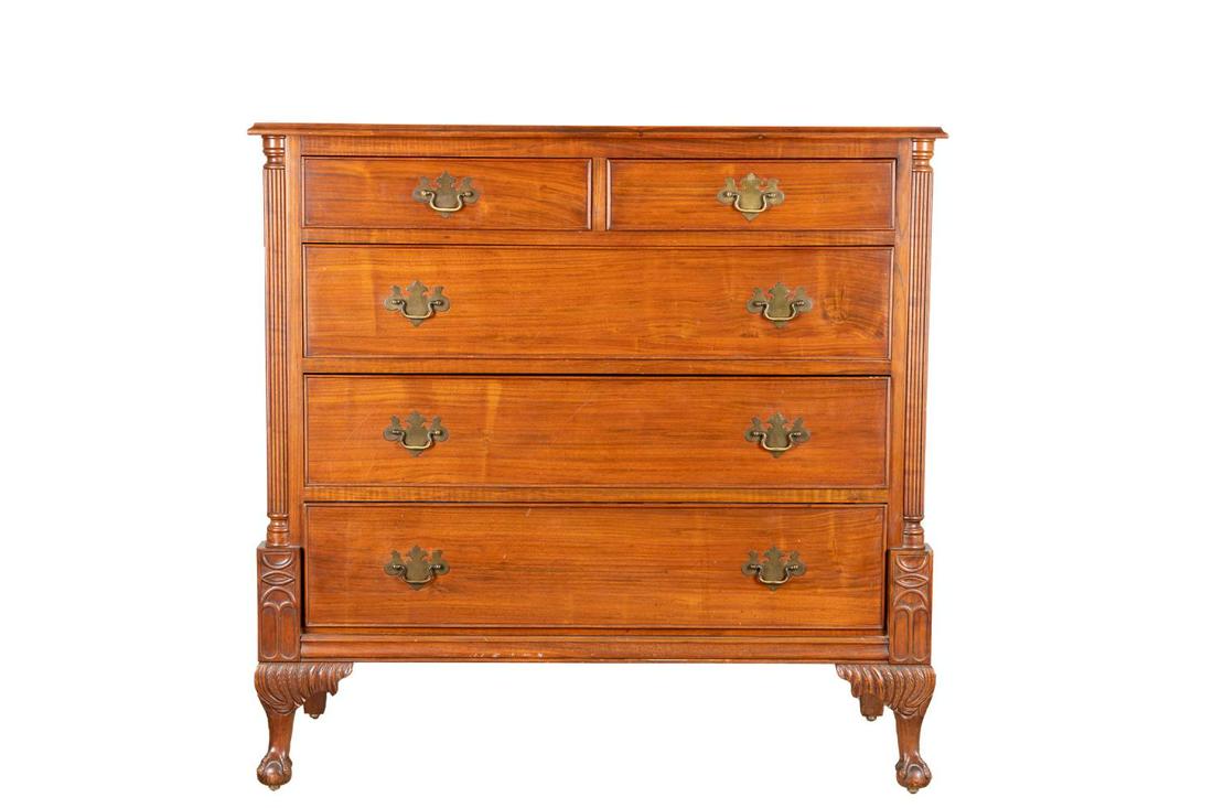 ENGLISH CHIPPENDALE STYLE MAHOGANY 5 DRAWER CHEST: English Chippendale style mahogany chest of drawers, 20th century, having a shaped top, over five drawers flanked by columnar supports, and rising on ball and claw feet, apparently unmarked. Provenanc