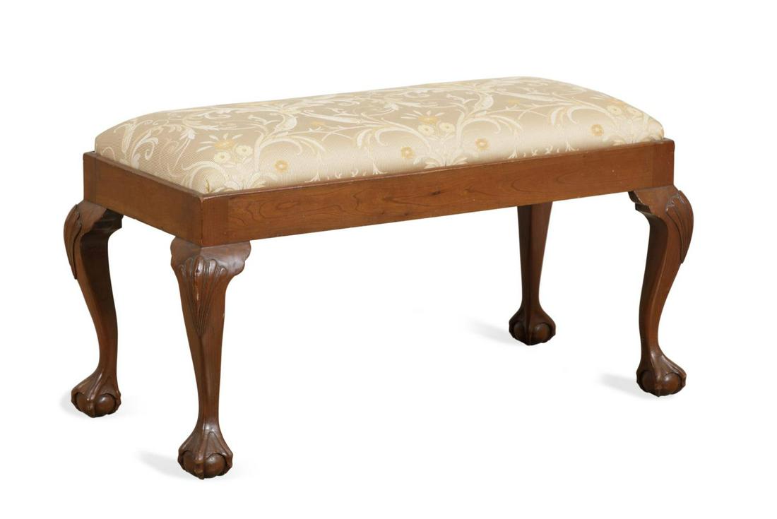 ENGLISH MAHOGANY BALL & CLAW FOOT WINDOW BENCH: English George II style window bench, 20th century, having a silk upholstered seat rising on tapered legs with shell knees and ball and claw feet, apparently unmarked. Approximate dimensions: h. 19",
