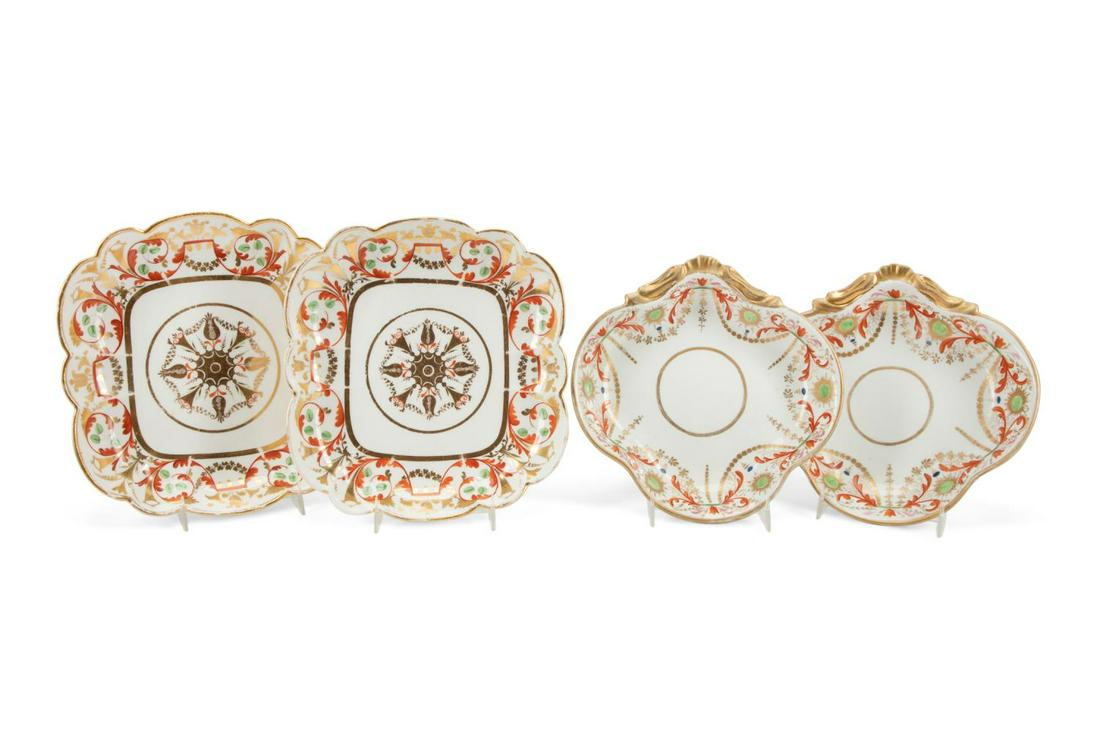 FOUR ENGLISH GILT IRON-RED DESSERT DISHES, C. 1820: Group of four English Spode or Derby gilded iron-red and green porcelain dessert dishes, circa 1820, comprising, a pair of square scalloped dishes with scrolled florals centering on a medallion (h. 1.