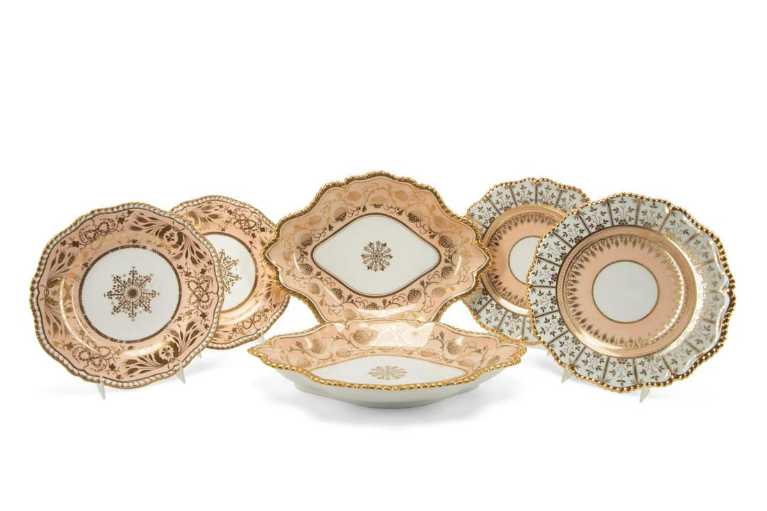 6PCS ENGLISH GILT PINK PORCELAIN TABLEWARE, 1820S: Six pieces of English gilded pink porcelain dessert tableware with gadrooned rims, circa 1820, comprising, a pair of Worcester Flight, Bar, and Bar lozenge form dishes decorated with strawberries (h. 