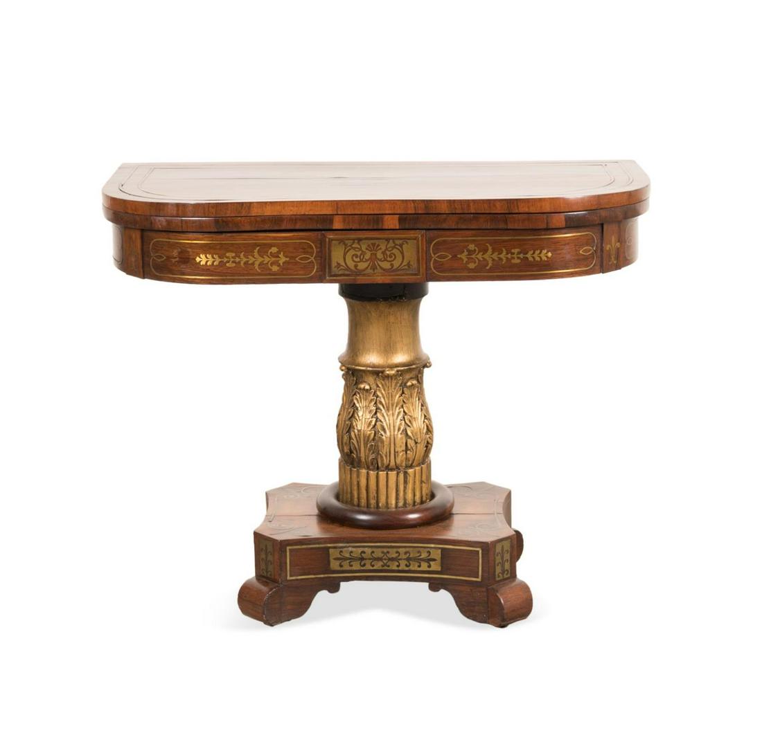 19TH C. REGENCY BRASS INLAID ROSEWOOD GAMES TABLE: English Regency brass inlaid rosewood veneer parcel gilt games table, 19th century, having a swivel flip top with green baize playing surface, acanthus carved pedestal on concave base, and rising on s