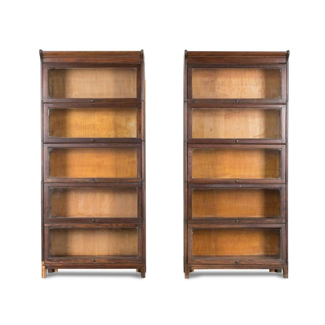 PAIR ENGLISH OAK BARRISTER BOOKCASE CABINETS: Pair of English oak barrister bookcases, 20th century, having five stacked compartments, apparently unmarked. Approximate dimensions: h. 75. 375", w. 34. 25", d. 13. 25".