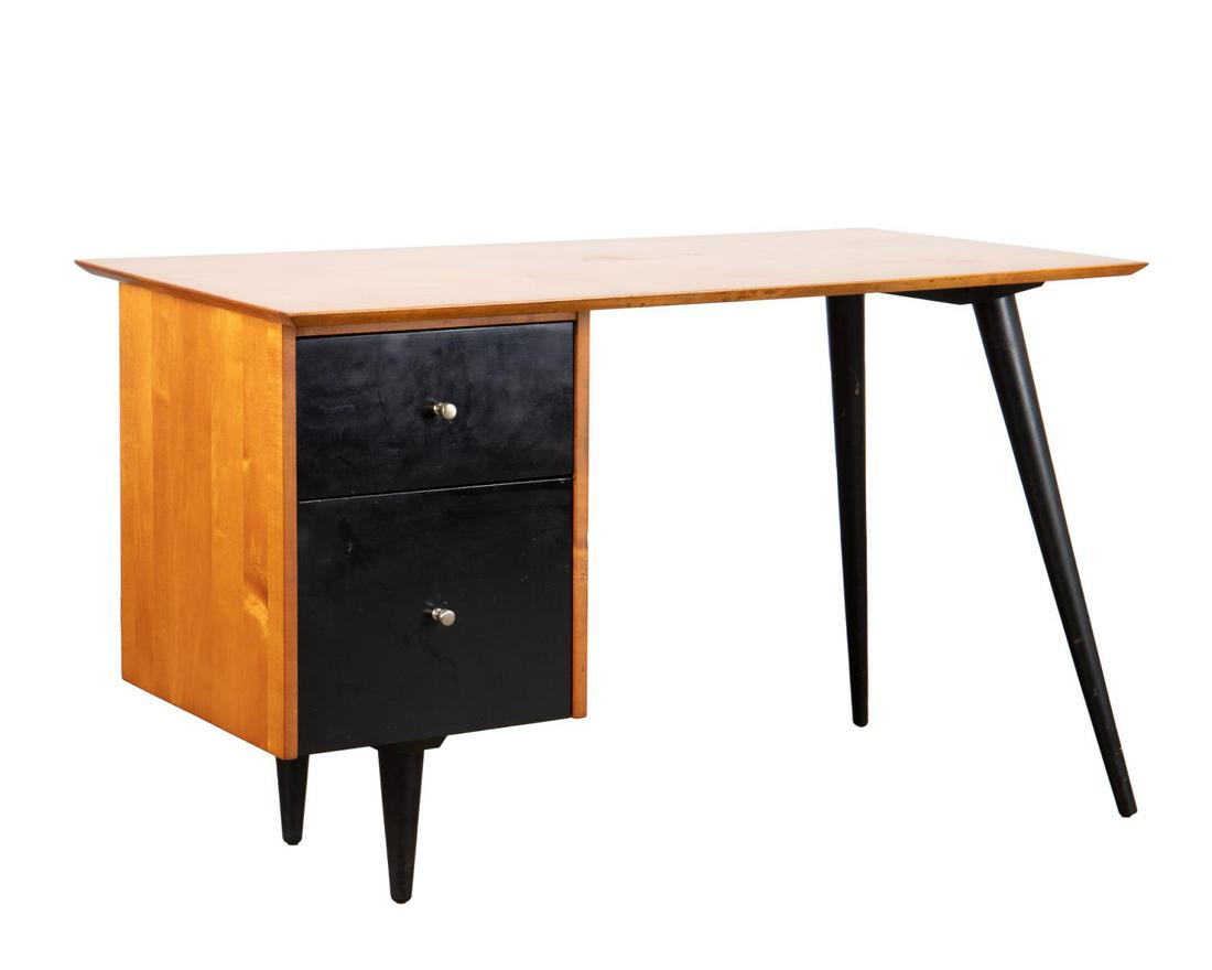 PAUL MCCOBB PLANNER GROUP MCM 2-TONE WOOD DESK: Paul McCobb for Planner Group for Winchendon Furniture Company, mid-century modern two tone desk, paper label to top drawer. Approximate dimensions: h. 28.75", w. 48", d. 24.25".