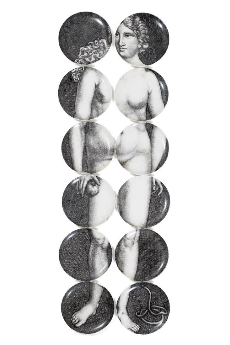 TWELVE PIERO FORNASETTI 'EVA' PLATES: Set of twelve Fornasetti (Italian founded 1970), "Eve" transfer decorated black and white circular porcelain plates, that together depict an image of Eve and the serpent, maker's mark and plate order