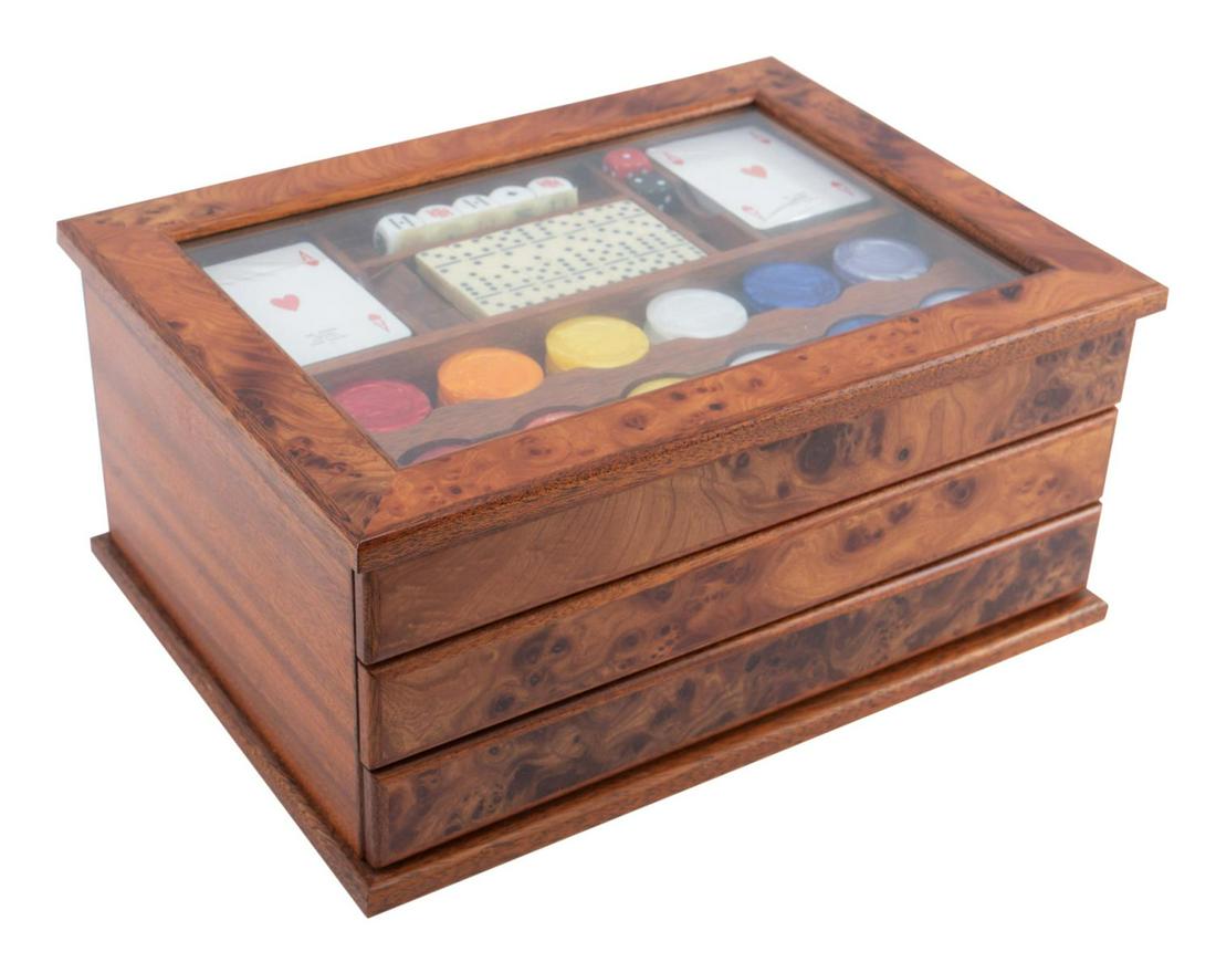 AGRESTI CASINO MULTI-GAME SET: Cased Agresti casino multi-game set, housed in a mahogany and burlwood chest with an inset glass top above three drawers, containing two decks of cards, dice, dominos, and chips, marked underneath. Pr