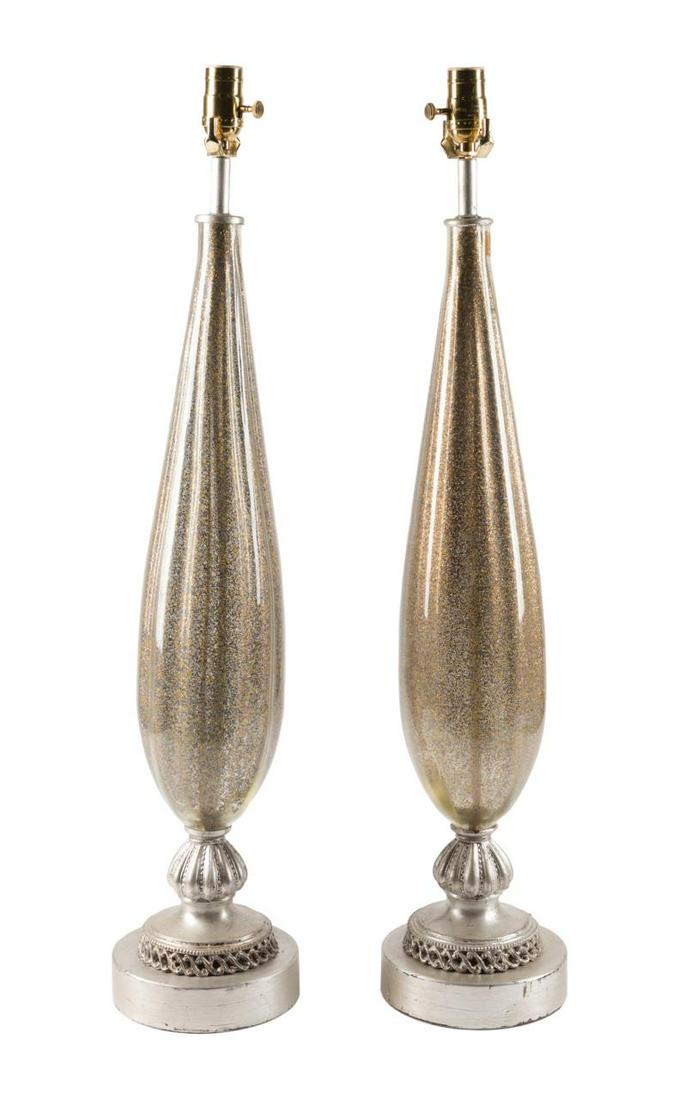 PAIR OF BAROVIER & TOSO STYLE MURANO GLASS LAMPS: Pair of Italian Murano glass lamps in the manner of Barovier & Toso (Italian 1925), each having an optic elongated body with gold and blue metallic flecks, on distressed silvered bases, one with "Made