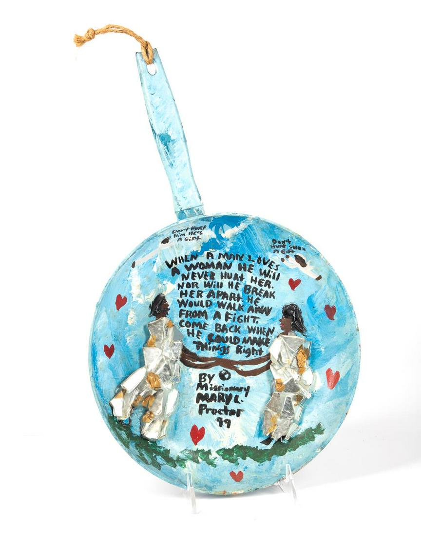 MARY PROCTOR MM FRYING PAN SCULPTURE, 1999: Mary Louise Proctor (American/Florida, b. 1960), mixed media sculpture, 1999, 'When a Man Loves a Woman,' painted frying pan with applied mirror and resin, having a text and two figures, signed and da