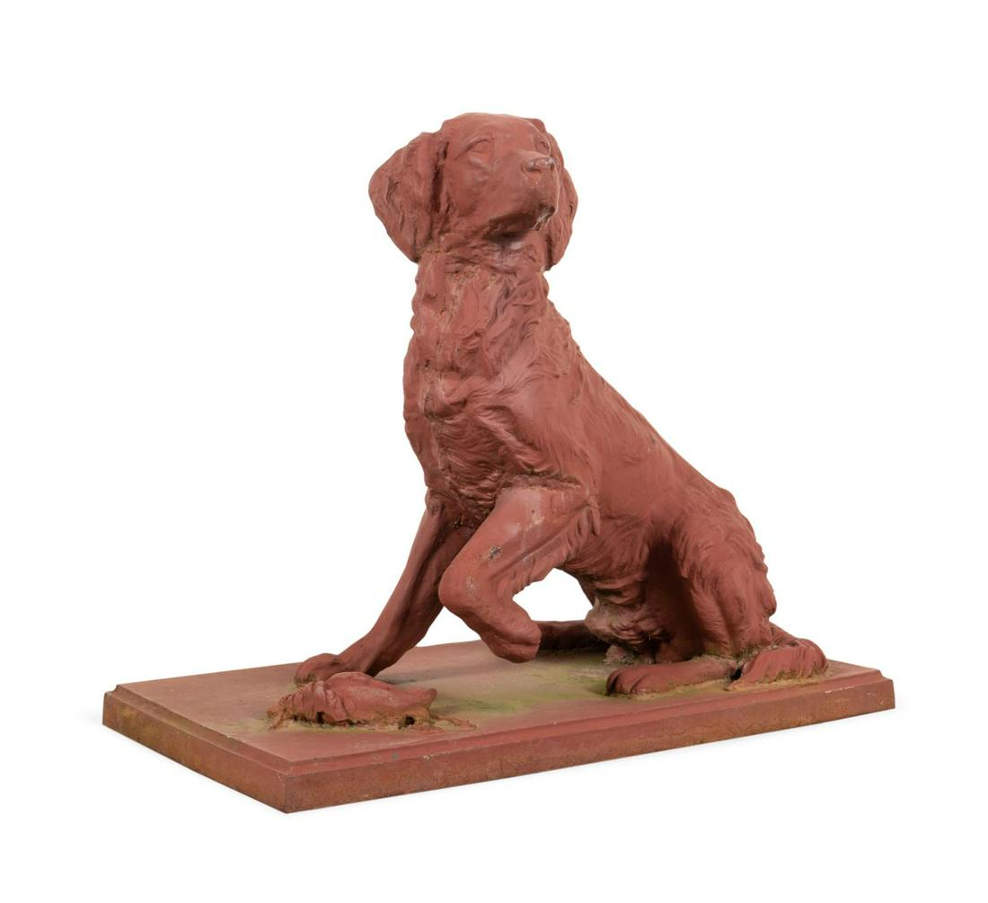 CAST IRON GARDEN STATUE OF AN IRISH SETTER: American red painted life size cast iron garden statue of a dog, late 20th century, modeled as an Irish Setter, with one leg crooked and a game bird below, on plinth base, apparently unsigned. Provena