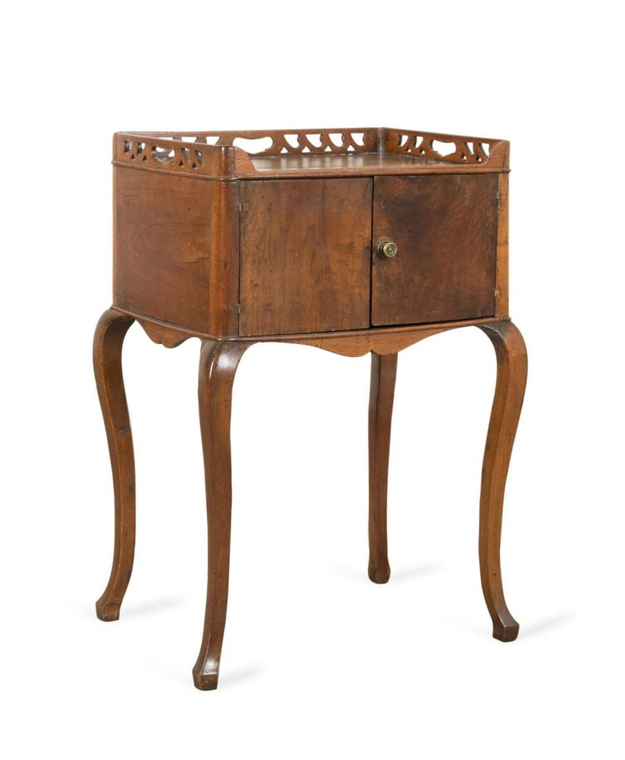 18TH C. PROVINCIAL LOUIS XV WALNUT BEDSIDE TABLE: French provincial Louis XV walnut bedside table, 18th century, having a pierced three quarter galley rail, double door with single drawer to the interior, and rising on cabriole legs, apparently unmar